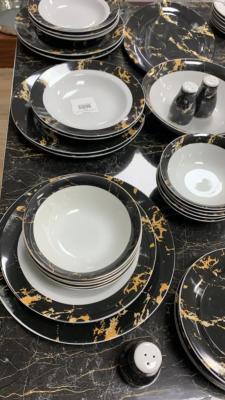 Service de table en porcelaine 28 pièces marbré noir et doré 